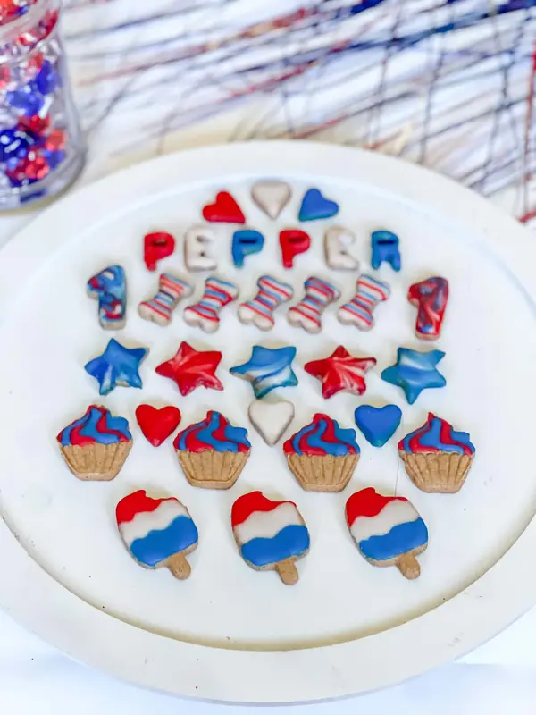 Red, white, and blue Fourth of July treats spelling PEPPER on a platter