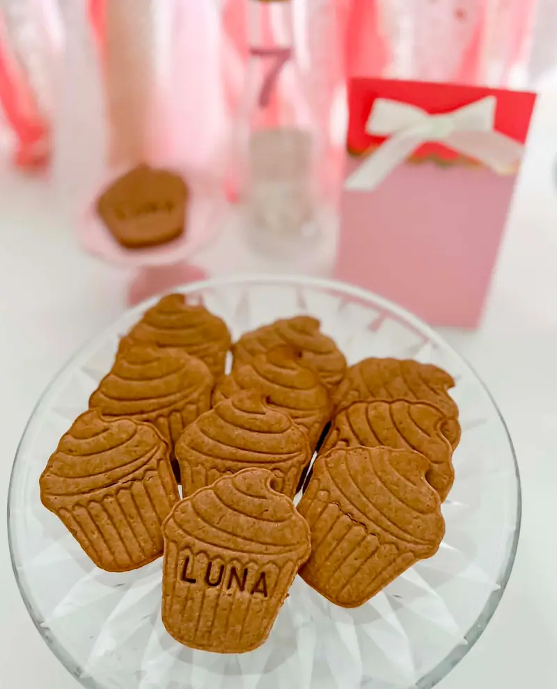 Personalized LUNA pupcake cookies stacked on a crystal cake stand